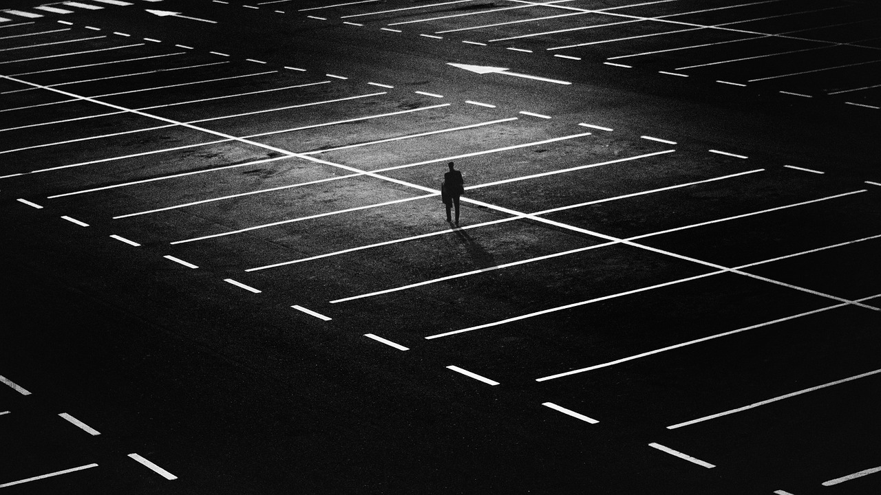 guy kicking the road or loafing around or whatever